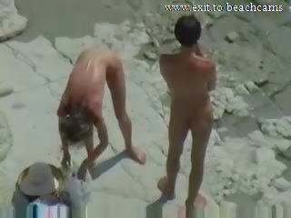 Spying libidinous Couple at Nude Beach
